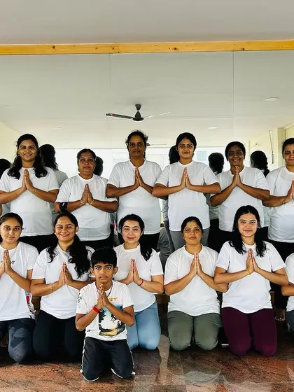 More smiling faces and hands in 'Anjali Mudra' from our Yoga Day gathering. The sense of community here is truly special.