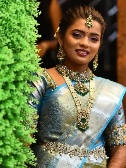 My client's engagement look. She chose a beautiful Victorian set with green stones and pearls that looked absolutely lovely with her light blue saree.