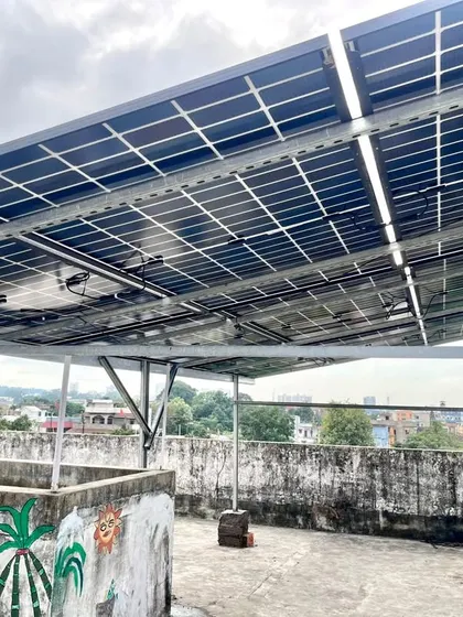 The completed 5kVA hybrid solar panel installation in Ranchi. The elevated structure allows for optimal sun exposure and keeps the rooftop space usable.