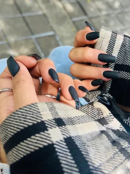 We love how these matte black stiletto nails look so sharp and stylish. A perfect choice for anyone wanting a bold and confident manicure.
