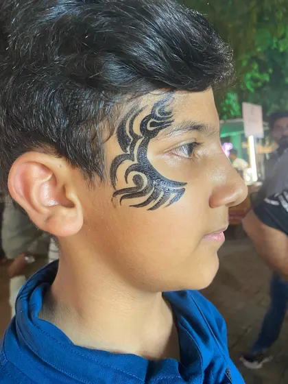 A black tribal design for this young man. It's a timeless and cool look.