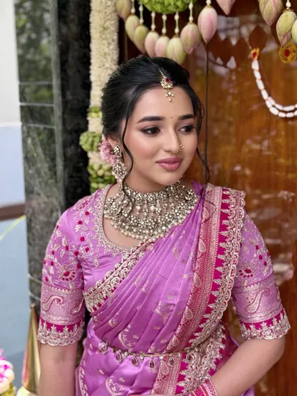 A vision of simplicity for a bangle ceremony. This look features a radiant, dewy finish and minimal makeup to let the bride's natural beauty and stunning Anushree Reddy saree shine.