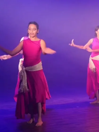 A moment of graceful expression from a group performance. Our beginner courses are designed to build a strong foundation, allowing students to eventually perform with confidence and artistry.