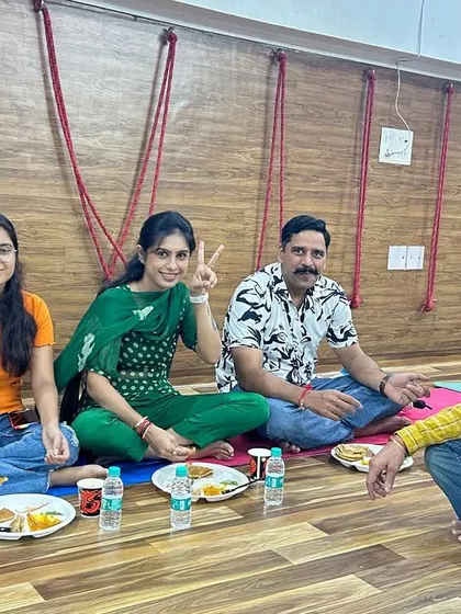 Enjoying a community meal (bhandara) together. Sharing food and conversation is how we strengthen the bonds of our Kula.