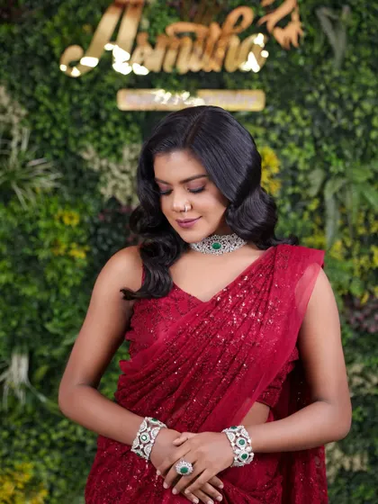 This pose showcases the full effect of the red carpet look, emphasizing how makeup and styling work together to create a cohesive, stunning image.