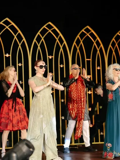 A full family performance with everyone wearing 'Kala Chashma'. Using simple props can make a group dance even more fun.