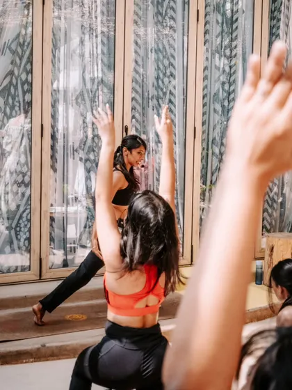 A candid shot of me teaching, filled with smiles. I absolutely love sharing what I learn, and every class is a new opportunity for connection.