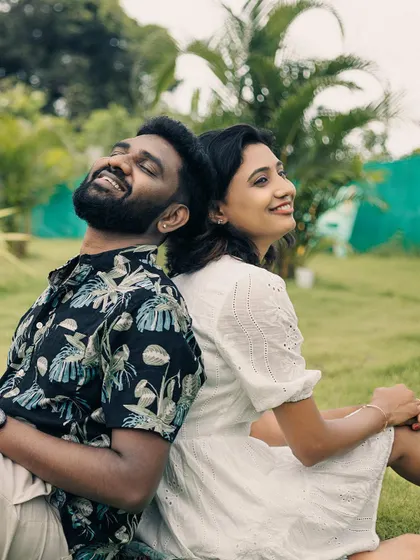 The couple shares a laugh, perfectly capturing the fun and easygoing nature of a post-wedding shoot.