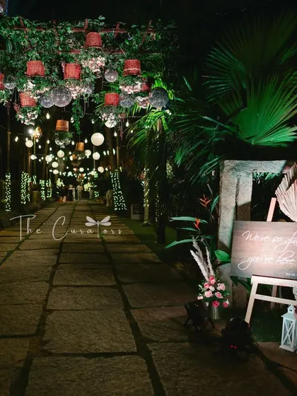 This shot captures the moody and romantic ambiance of the reception entrance, promising a night of elegance and celebration.