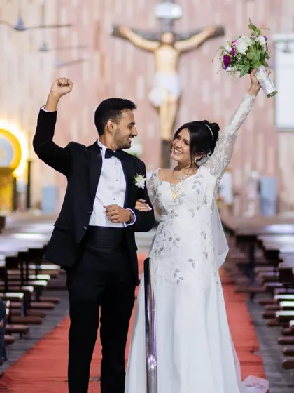 We are married. The couple's triumphant exit from the church is a moment of pure celebration and joy.