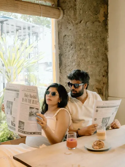 Reading all about it! This shot of the couple with their "Baby Is On The Way" newspaper is a fantastic and stylish way to announce their pregnancy.