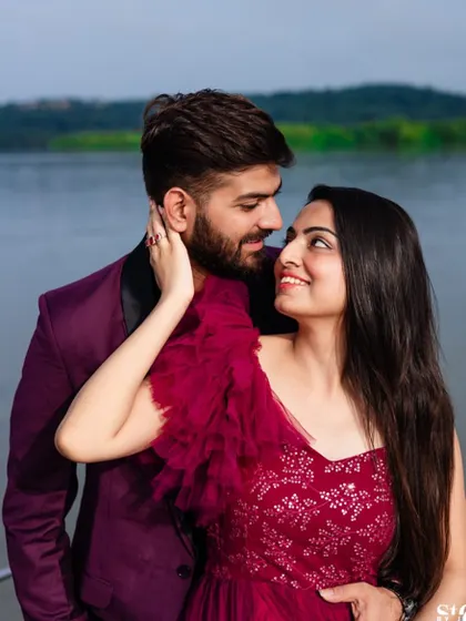 A close-up of the couple, capturing their happy expressions and the details of the magenta gown's bodice.