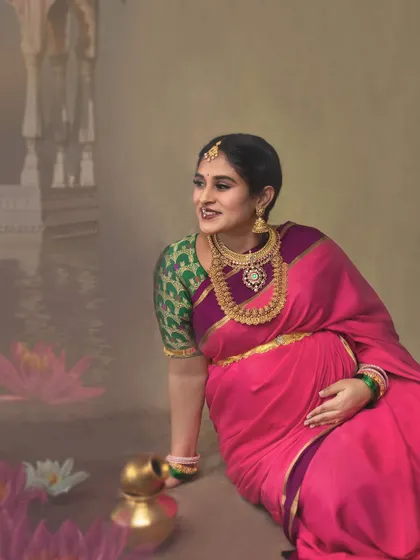 A serene moment by the painted lotus pond, this portrait has a calm, reflective quality. The mother-to-be's gentle smile and the soft colors create a beautiful, artistic memory.
