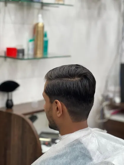 The back view of a perfectly executed taper fade, showing the clean lines and smooth gradient that define a quality men's haircut.