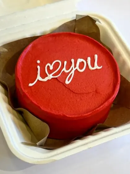 A classic red bento cake with a simple "i love you" message. This design is timeless and perfect for Valentine's Day, anniversaries, or any day you want to share some love.
