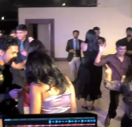 A Catholic wedding party with guests enjoying English retro and jive music.