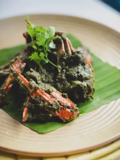 Crab in a green masala paste, a coastal delicacy. We teach how to make these complex pastes from scratch using fresh herbs and spices.