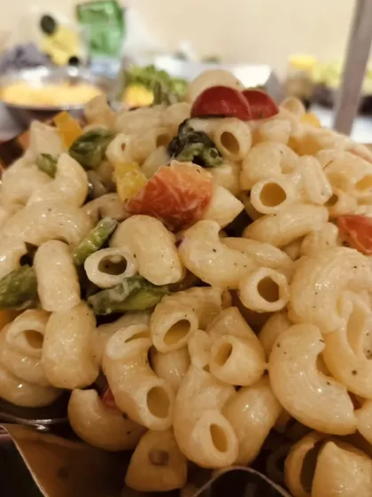 A close-up of my vegetable macaroni salad, a crowd-pleasing dish that is perfect for events with guests of all ages.