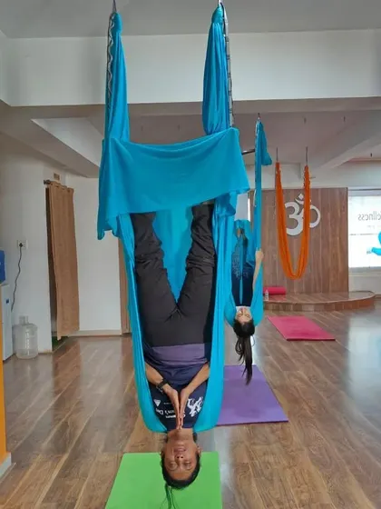 Experience the freedom of hanging upside down in our Aerial Yoga class. This practice helps decompress the spine and offers a playful new perspective.