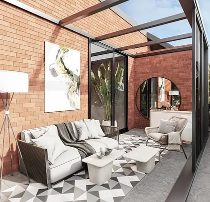 A glass box pavilion extends from the master suite in a Kolgaon villa. This flexible indoor-outdoor space can be used as a reading corner, an office, or a bar, offering a private retreat with views from the top of the house.