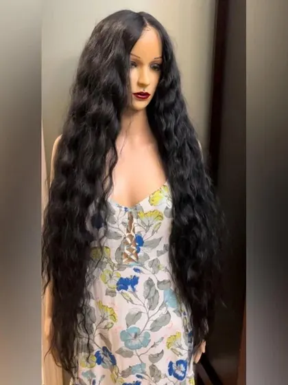 A 50-inch long wig in a natural wavy texture. This piece combines incredible length with beautiful, soft waves for a mermaid-hair look.
