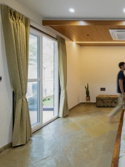 The flooring in the master bedroom is cool Kota stone laid in a diamond pattern, which contrasts beautifully with the warm wood ceiling detail.