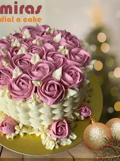 A strawberry flower basket cake that is both rustic and charming. The buttercream basket weave is filled with a bounty of pink strawberry-flavored roses.