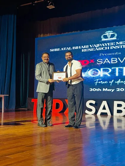 Receiving a token of appreciation after my performance at the TEDx event. I am always grateful for the opportunity to connect with new audiences and the organizers who make these events possible.