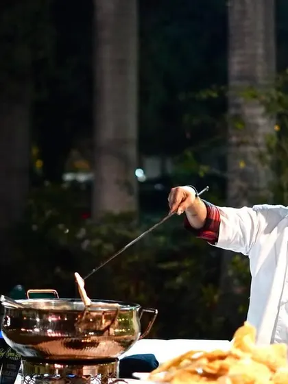 Our chefs are the stars of the show, even at smaller parties. This image captures our chef at a live counter during a birthday celebration, adding a touch of culinary theater to the event.