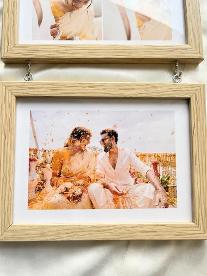 Preserve the joyous occasion of Haldi with our beautiful photo frames. This hanging frame is perfect for displaying a series of moments from the special day.