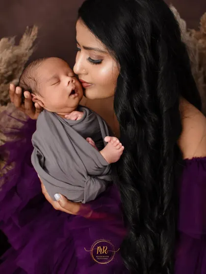 Another beautiful mother and newborn close-up. I use soft swaddles and careful posing to keep the baby comfortable and secure during the shoot.