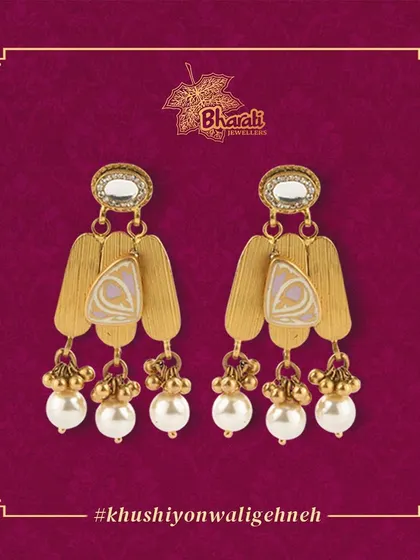A beautiful statement piece, these earrings are enriched with pastel Meenakari work on matte gold plates. The design is completed with Kundan work and droplets of lustrous pearls, creating a look of modern elegance.