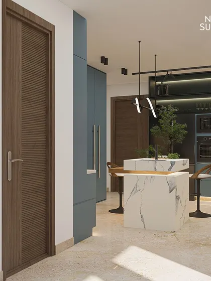 A detailed view of our Ireo Gurgaon Hills kitchen, focusing on the textured wooden door and the sleek, fluted cabinetry in a sophisticated blue-grey. The marble island adds a touch of timeless luxury.