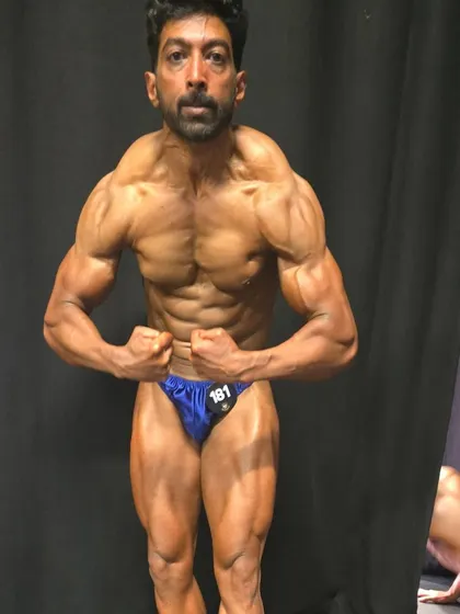 A most muscular pose backstage. Even after the show, we keep the intensity up.