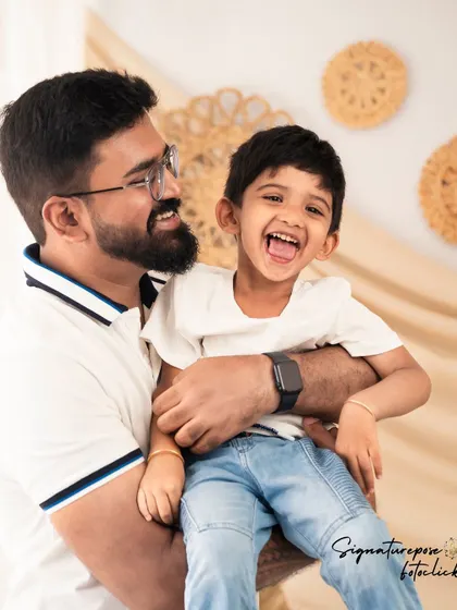 A candid moment of pure joy between a father and his son. We love capturing the playful and loving relationships within a family.