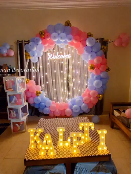 A full view of the 'Welcome Home' setup for baby Kalpit, showing how it transforms a living room space.