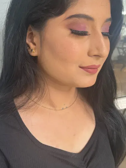 A side profile of a practice look. This angle shows the soft blend of the pink eyeshadow and the clean line of the eyeliner.