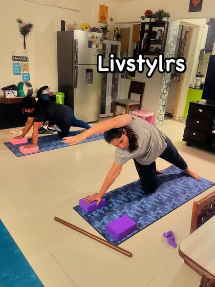 Two clients perform a modified side plank, a great core-strengthening exercise that can be adapted for all fitness levels.