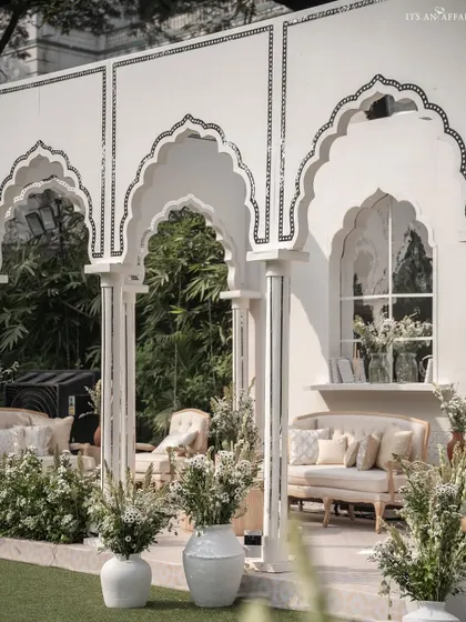 A closer look at the seating alcoves within the 'Oasis of Love' pavilion, adorned with delicate mirror inlay work on the arches.