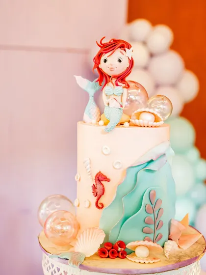 The centerpiece of the mermaid party was this incredible cake. I always capture the details, and this Little Mermaid cake with its intricate shells and seahorses was too amazing not to feature.