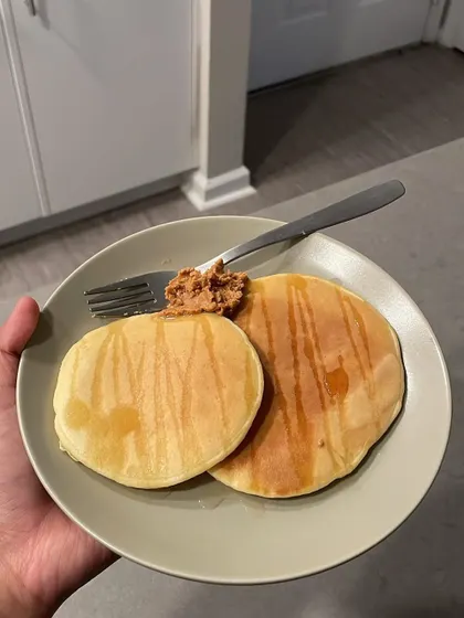 Pancakes for breakfast! Enjoying treats is a normal and healthy part of a sustainable diet. Here's a plate of fluffy pancakes with a bit of syrup, a meal I enjoyed while on vacation without any stress or guilt.