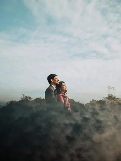 A truly magical pre-wedding moment for this couple, wrapped in mist on a Lonavla hilltop. We used a smoke effect to create this dreamy, 'head in the clouds' feeling, making their love story look like a scene from a movie.