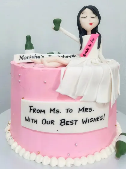 The "bachelorette party" cake! A fun lemon blueberry cake for Manisha's last celebration as a single lady, featuring a "bride-to-be" figurine enjoying a glass of wine.