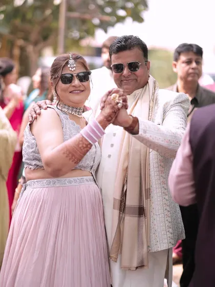 Parents of the groom enjoying the baraat. We love capturing these moments of family members dancing and celebrating together.