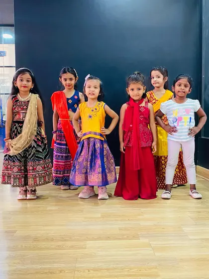 Our little dancers posing for a photo after class. Dressed in colorful outfits, they are ready to take on any routine. These classes are a great way for kids to express their personality.
