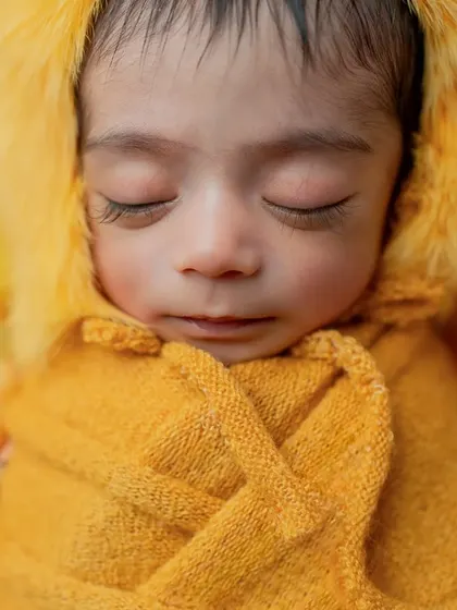 Another beautiful close-up, focusing on the baby's peaceful expression and perfect features.