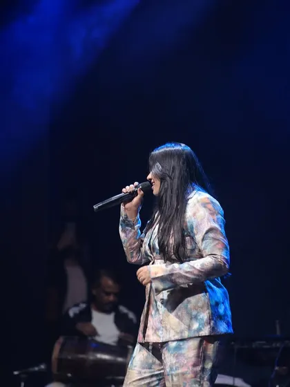 Another moment from my performance, with the dholak player in the background. The live band adds so much energy to the concert experience for our students.