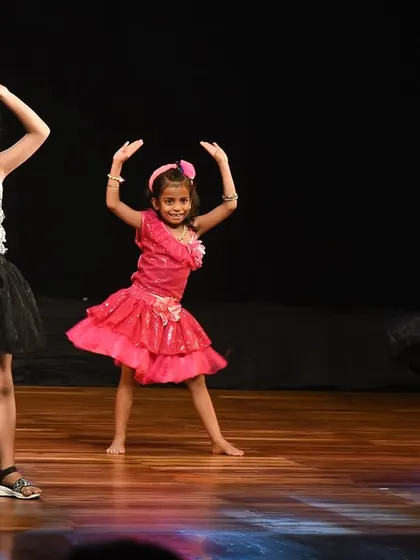 A beautiful moment of twirling, with their colorful skirts adding to the visual spectacle of the dance.