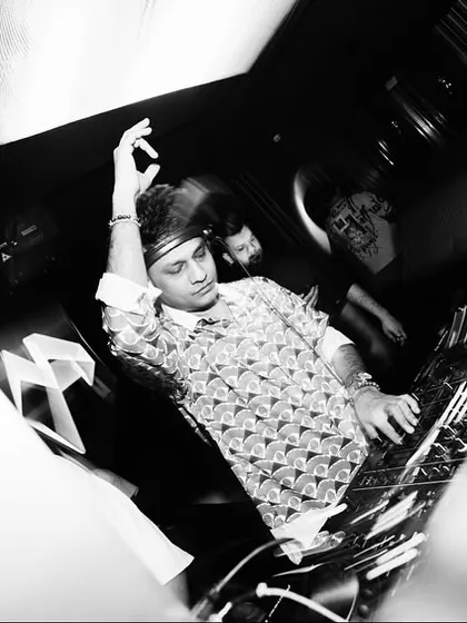 A black and white, motion-blurred shot of me at the decks in Dubai, capturing the movement and energy.