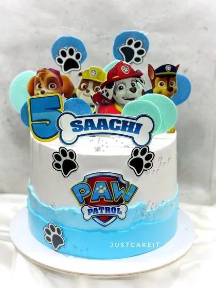 A Paw Patrol cake with 2D toppers. This is a great option for a clean, fondant-free design that still captures the look of the show.